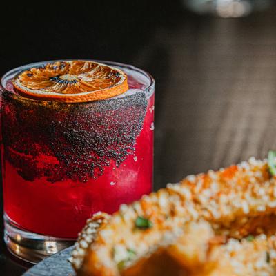 Remolacha beverage with Creyente Mezcal, beet juice, lime juice, and agave syrup.