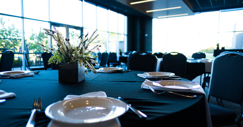 Interior, table with tableware and blue tablecloth