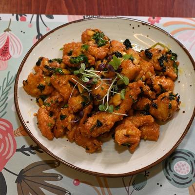 Boneless swai fish pieces deep fried and tossed with 65 sauce.