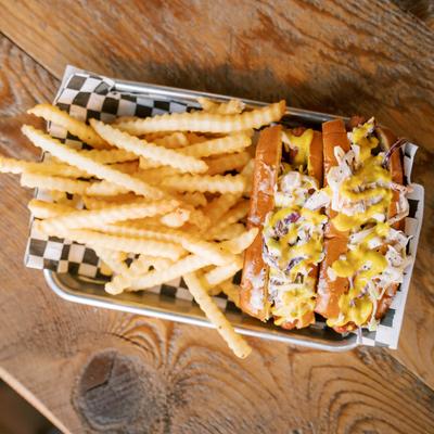 Double dog, served on a tray with crinkle fries, top view.