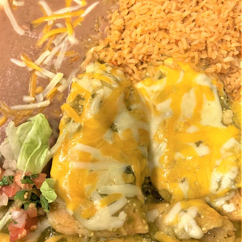 menu item 95 of 122, 2 Tamales with sauce, melted cheese, rice & beans.