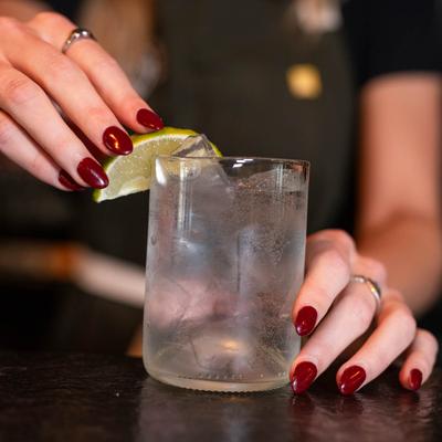 Bartender preparing a cocktail drink.