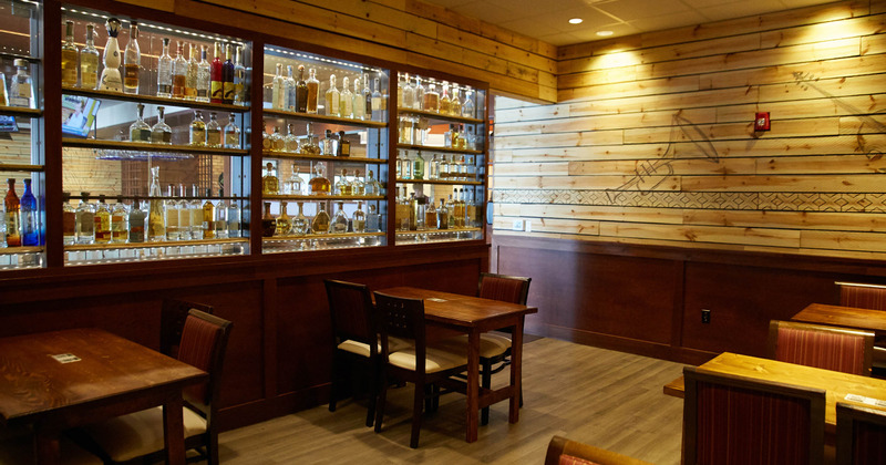 Interior, shelves with drinks and tables