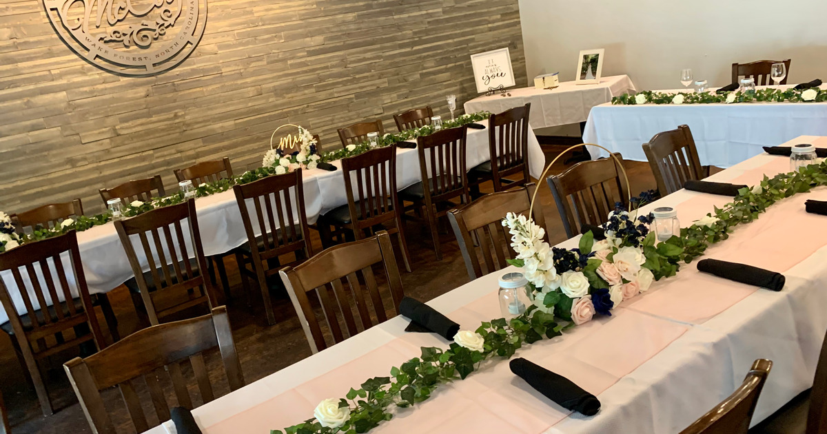 Interior, decorated tables ready for a wedding