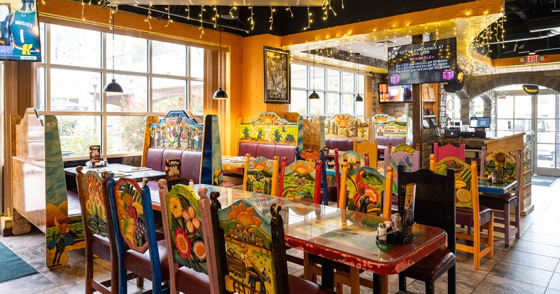 Mexican-style interior dining area with set tables
