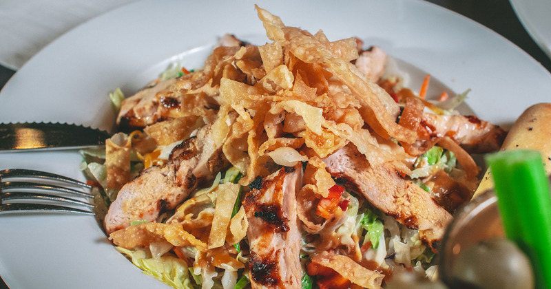 Steak, lettuce and chips salad closeup
