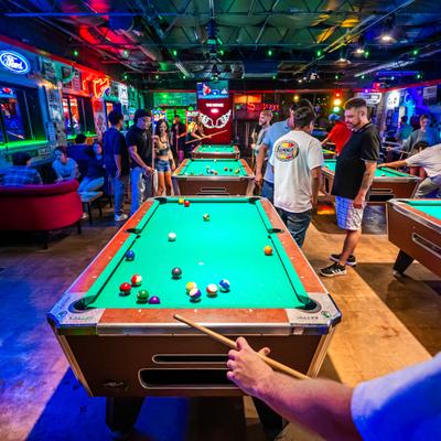 Customers playing pool.
