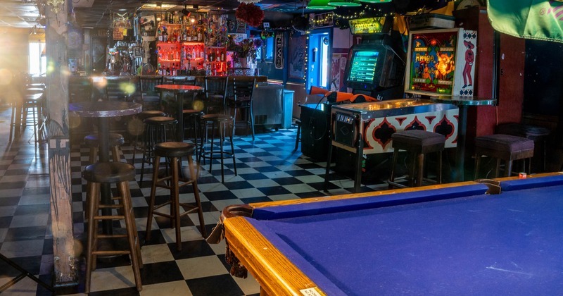 Interior, gaming area, tables and seating near the bar