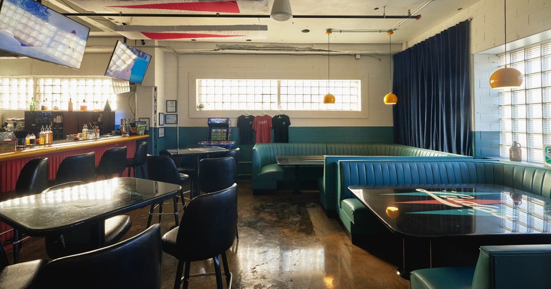 Interior, wide view of seating area, bar area on the left