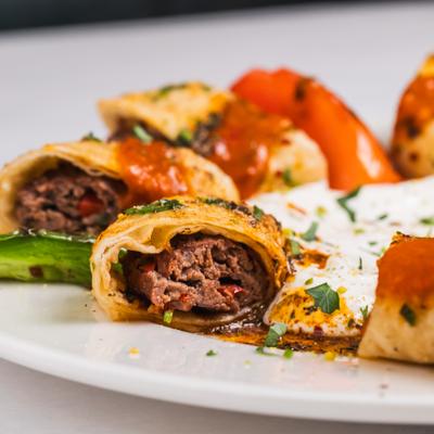 Turkish lamb meat rolls served with yoghurt sauce.