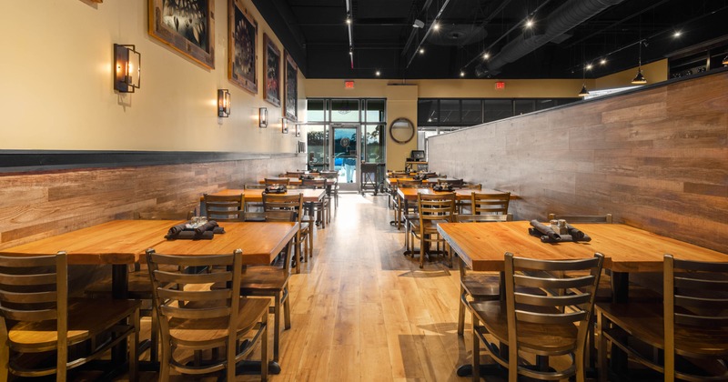 Restaurant dining room with wooden tables and chairs