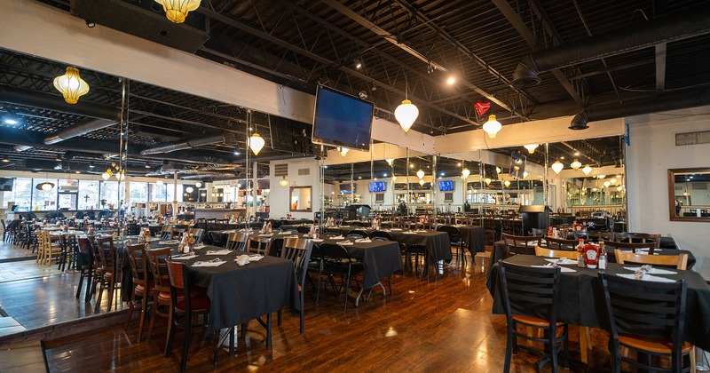 Cozy dining area with set dining tables ready for guests