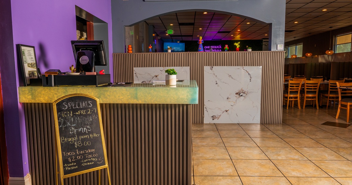 Diner table, chair, food counter behind