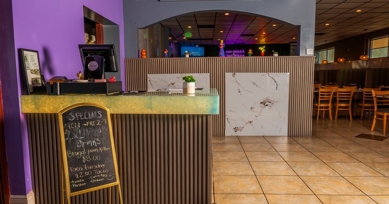 Diner table, chair, food counter behind