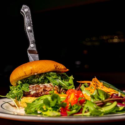 Cheeseburger with arugula.
