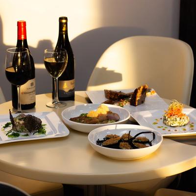 Wine and food on the table.