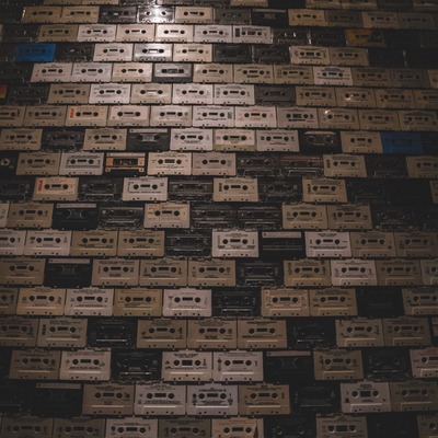 Wall entirely covered with cassette tapes.