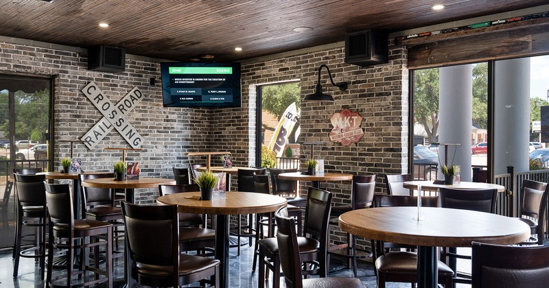Interior space, seating area with high tables and stools
