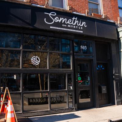 Exterior, storefront with entrance and signage.