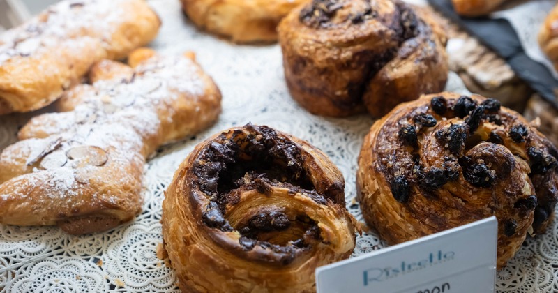 Cinnamon swirls served alongside other pastries, close-up
