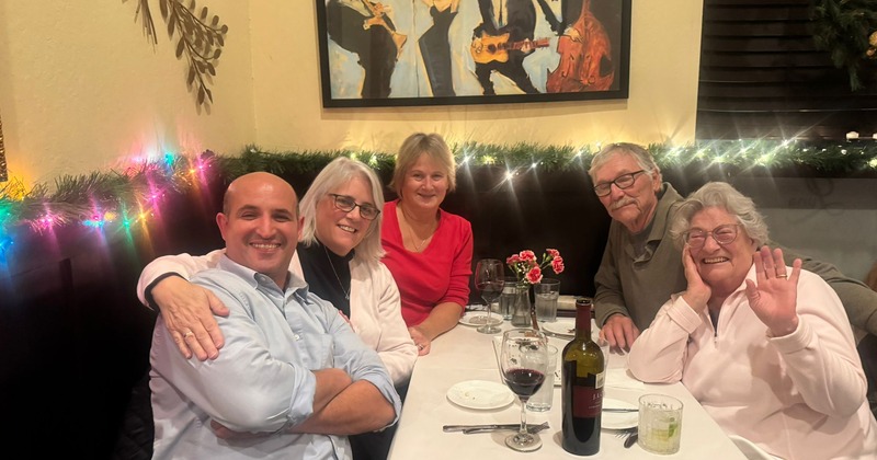 Interior, a group of people posing for a picture at a table