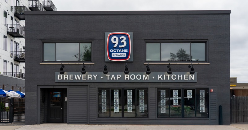 Exterior, front view to brewery, entrance, sign, parking lot