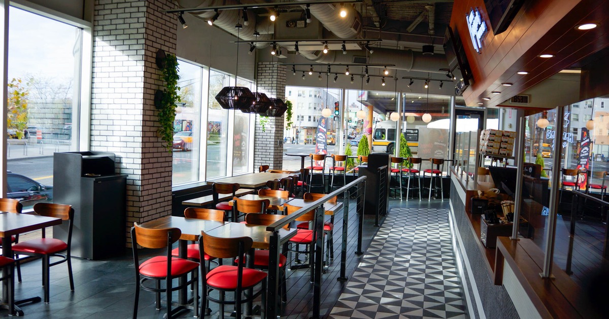 Interior, dining area, tables for four and eight, high seating, large shop windows