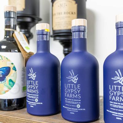 Olive oils in sealed bottles.