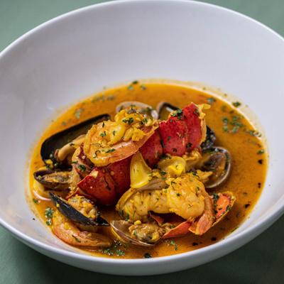 Cioppino, Lobster tail and fresh seafood in a tomato broth.