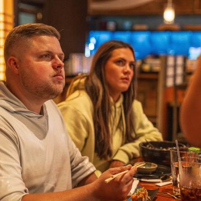 Two guests having food at the table.