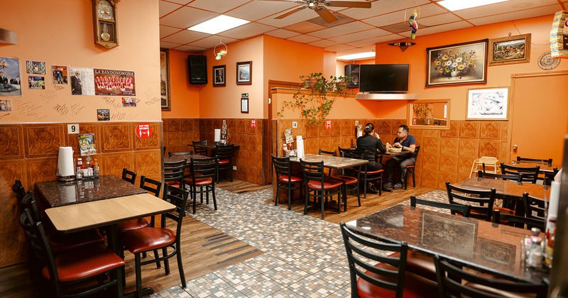 Interior, dining area, two guests enjoy their food