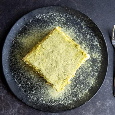 Thai Green Tea Tiramisu  on a black plate.