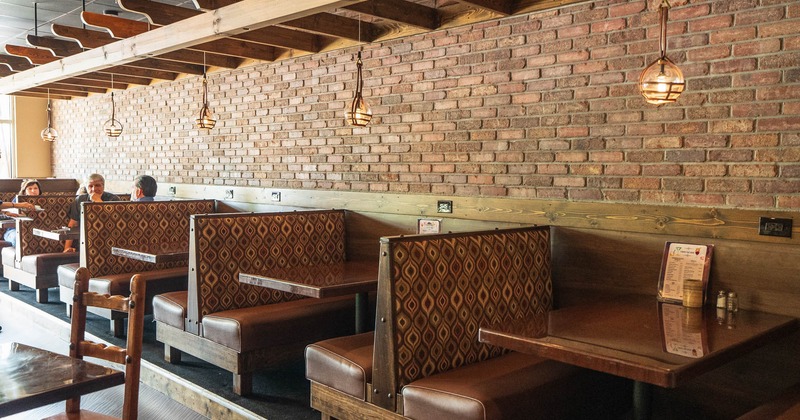 Interior, seating area with booths along the wall