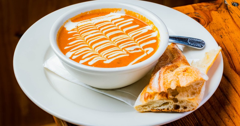 Tomato Basil Soup served alongside toasted bread