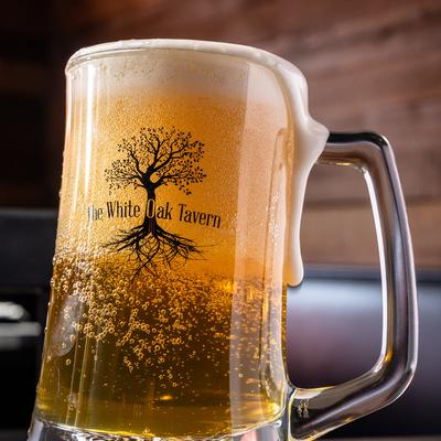 Frosted beer mug filled with golden beer.