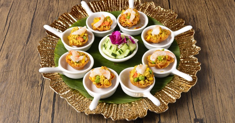 Golden Cups served with a small cucumber salad in the center