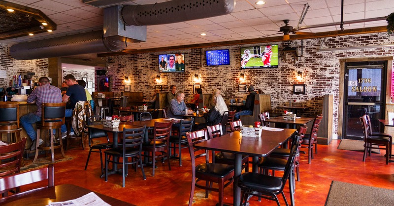 Interior, tables and chairs, tv's above