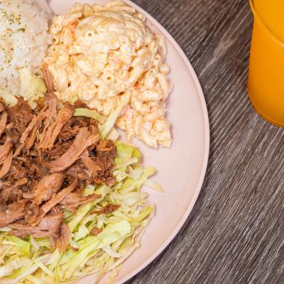 Kalua Pork served with shredded cabbage, rice and macaroni salad.