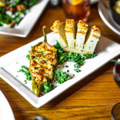 Stuffed Pepper served with seasonal bread.