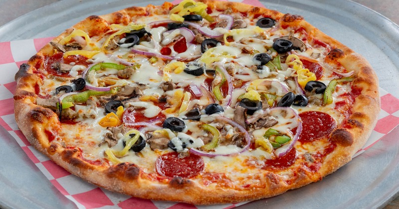 Supreme pizza with mixed vegetable toppings and pepperoni