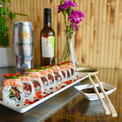 Tuna sushi rolls, topped with salmon and jalapenos.