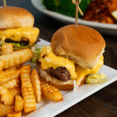 Waygu brisket sliders served with crikle-cut fries.
