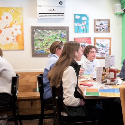 Guests seated at tables.