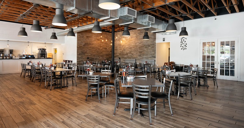 Interior, tables and chairs in dining area