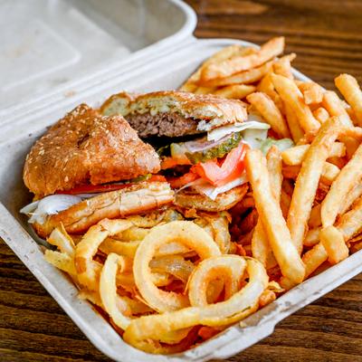 Burger with onion rings and fries.
