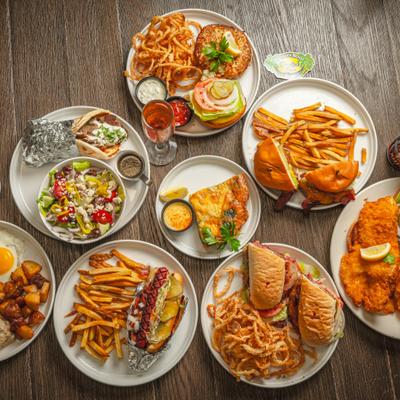 Group photo of few dishes served on a table.