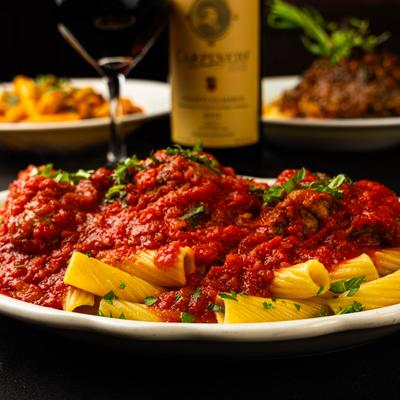 Rigatoni pasta in marinara sauce.