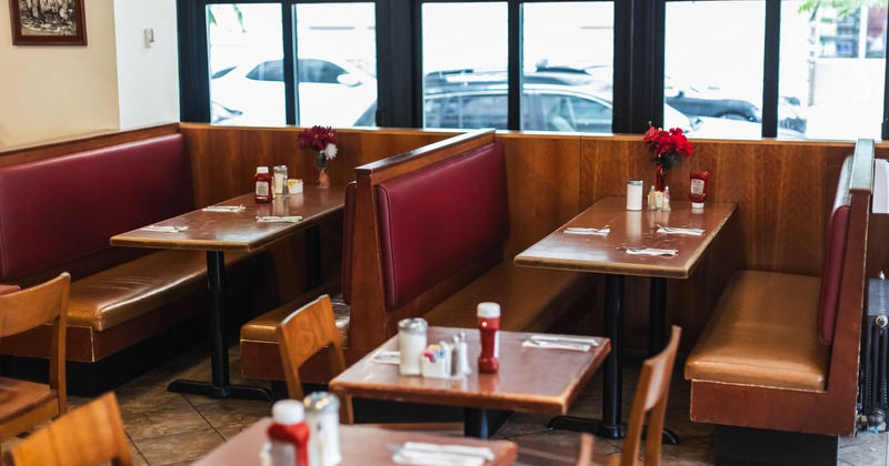 Interior seating area with booths, chairs and tables