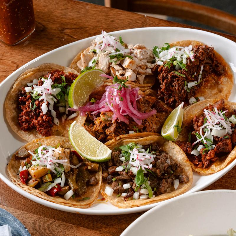 Trio De Tacos Con Mole photo