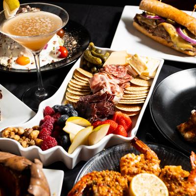 A variety of dishes and a drink.